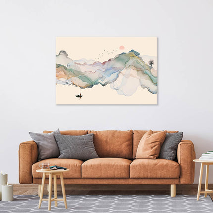 Leinwand in 120x80cm an einer grauen Wand über einer Couch im Wohnzimmer. Es ist bunt bedruckt mit einer traumhaften Aquarelllandschaft.